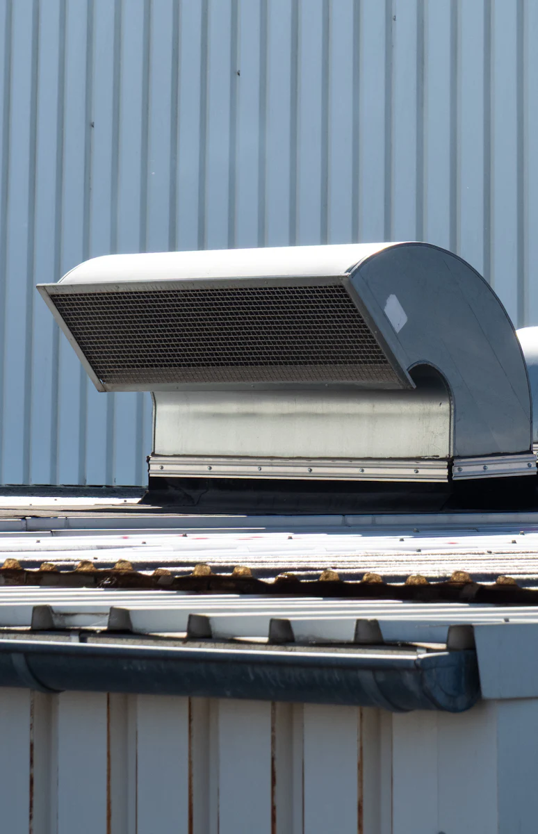 Rooftop ventilation units on a commercial roof