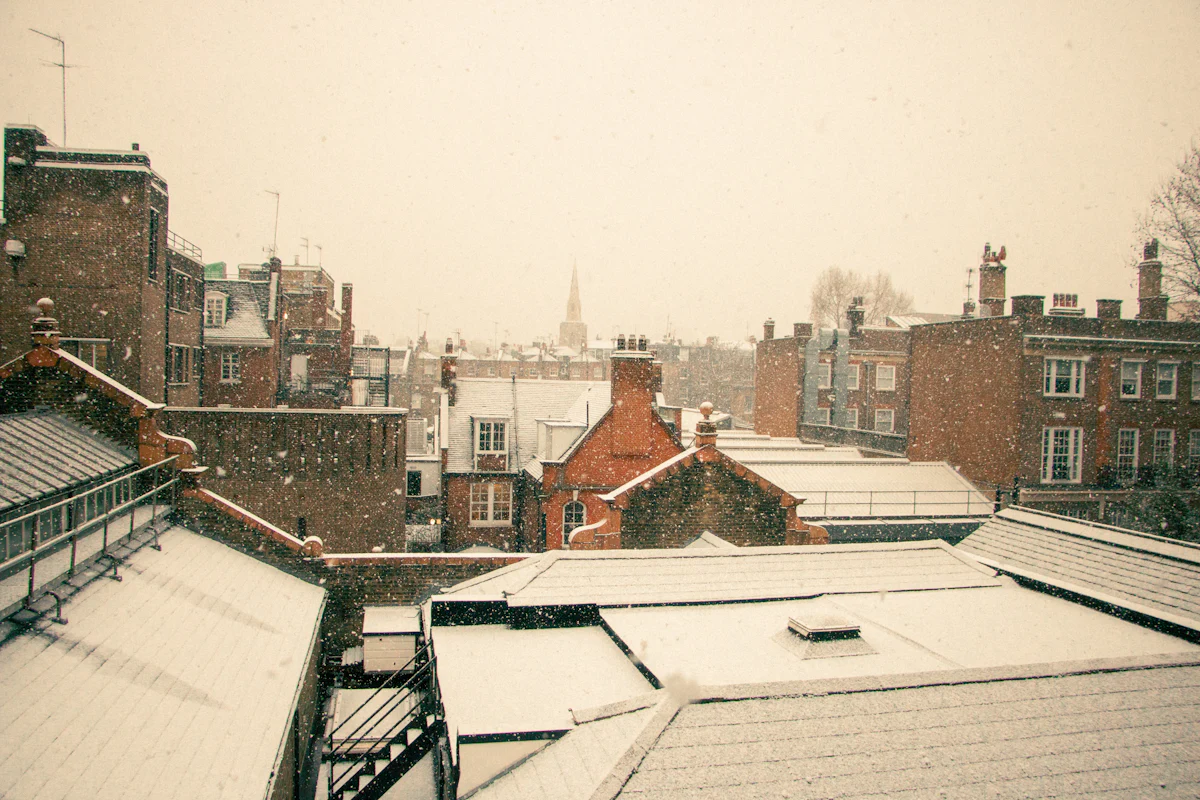 City flat roofs after snowfall