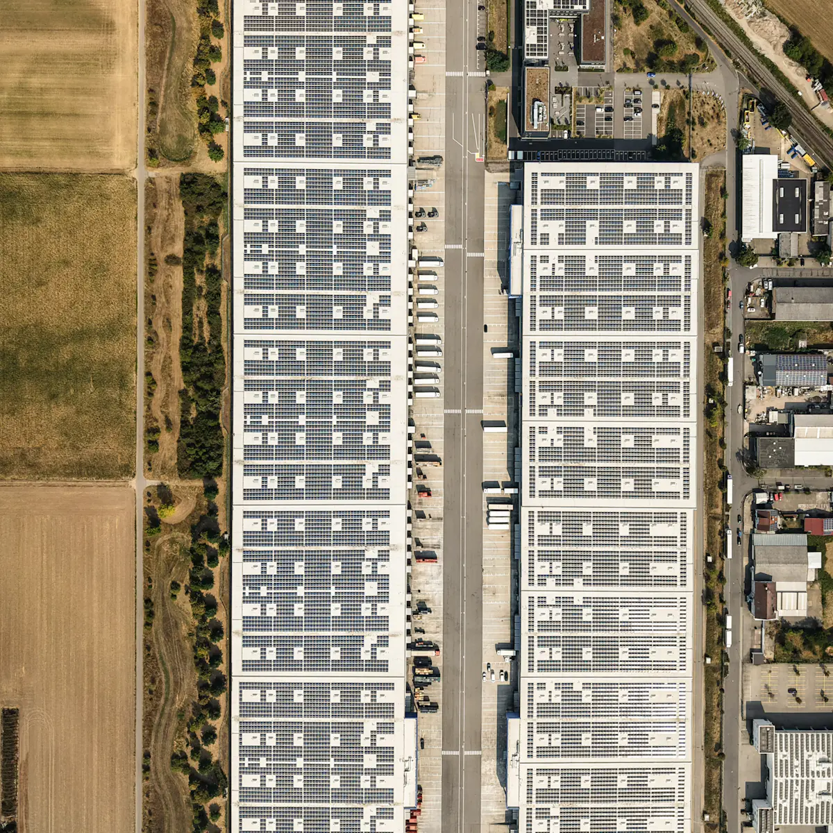 Aerial view of large industrial warehouse roofs