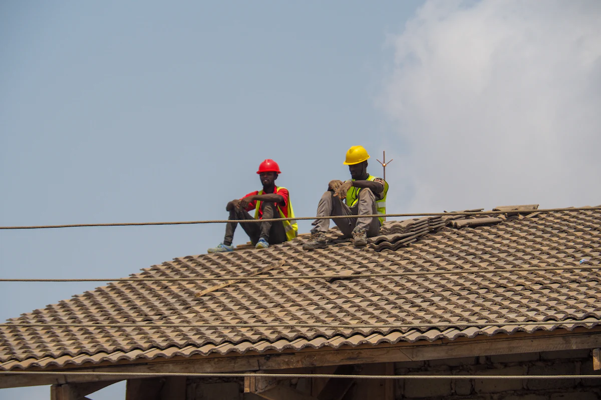 Roofers working on a roof replacement