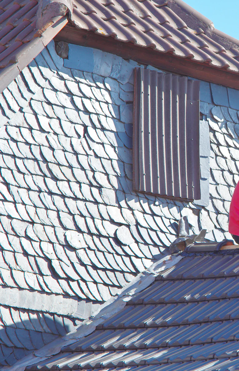 Roofers removing and replacing old roofing