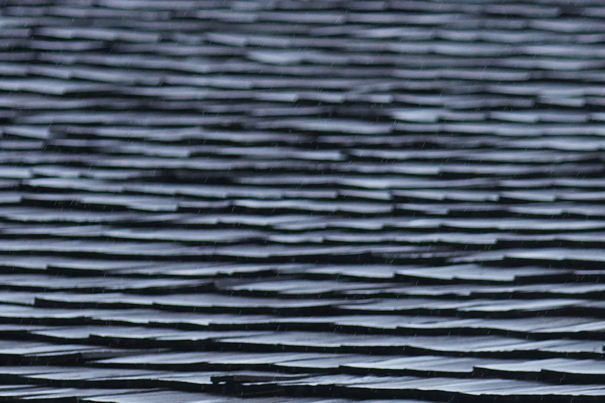 Rows of asphalt roof shingles